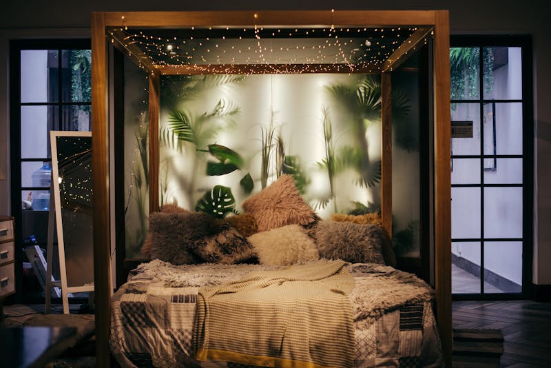 Cozy bed with warm lamp light — sleepy indica cannabis strain effect for nighttime wind-down